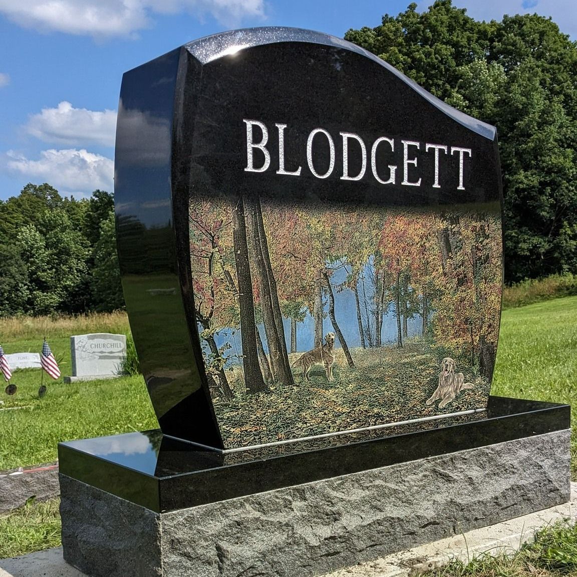 A black gravestone with the name blodgett on it