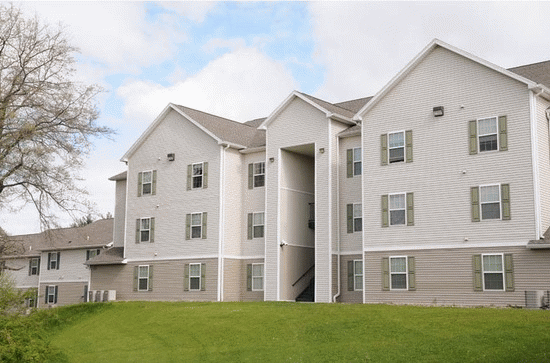 A large apartment building with a lot of windows