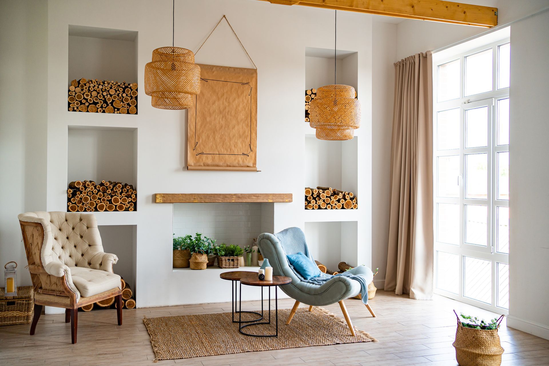 Cozy living room with built-in shelves of firewood, two chairs, and woven lamps.