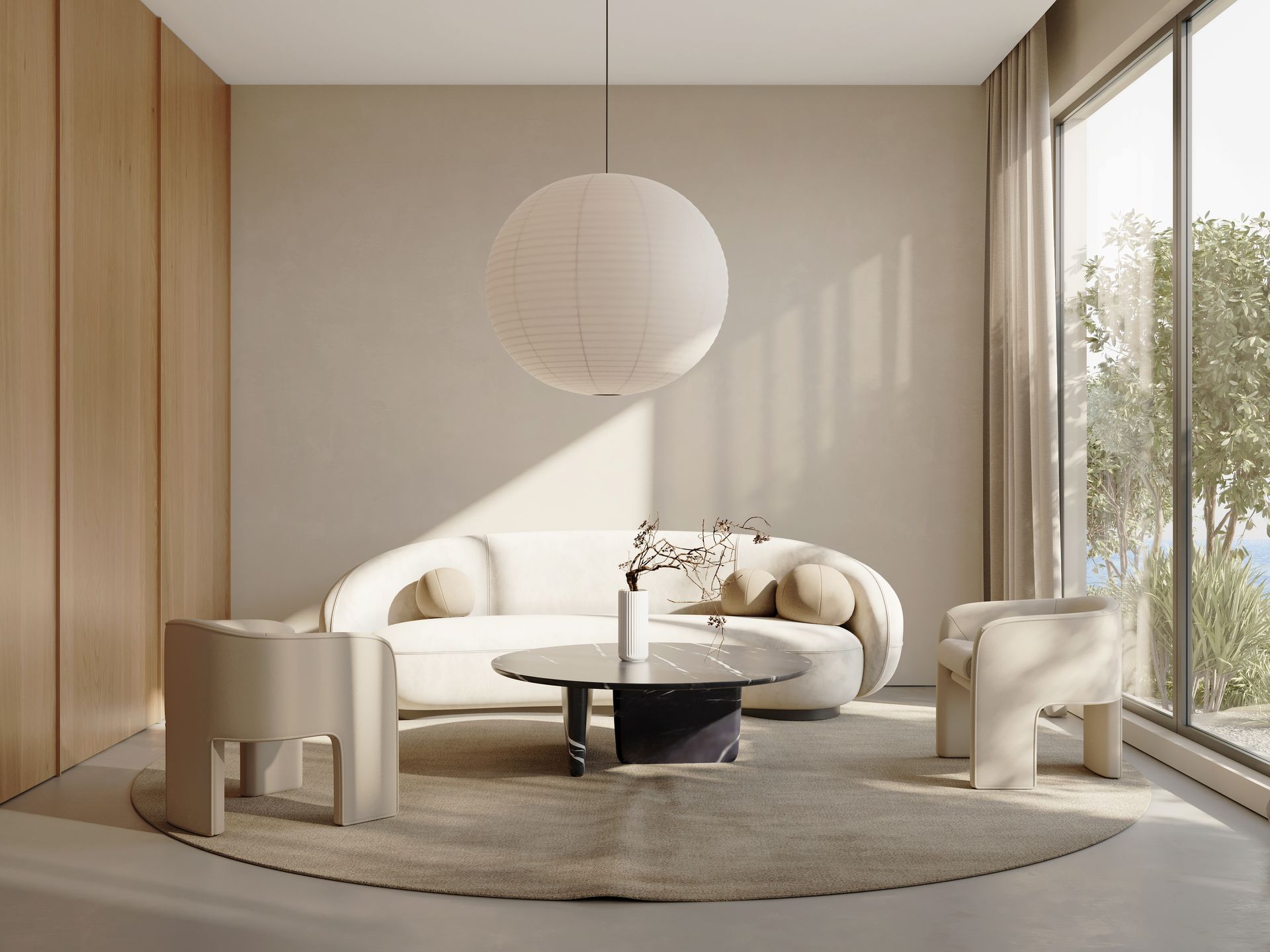 Living room with cream-colored sofa, chairs, round rug, and spherical light fixture. Large window and neutral tones.