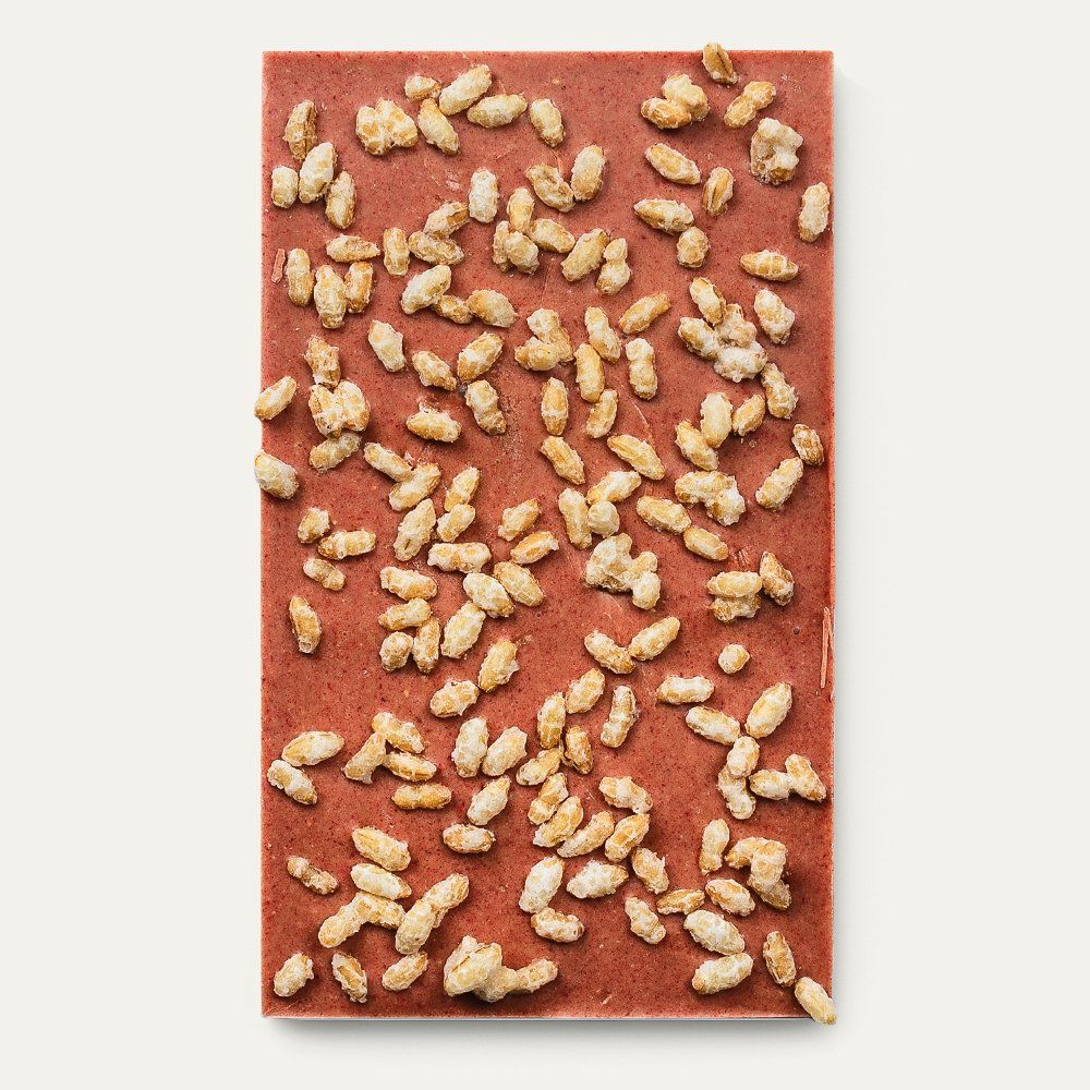 Pink caramelized white chocolate bar with puffed rice bits