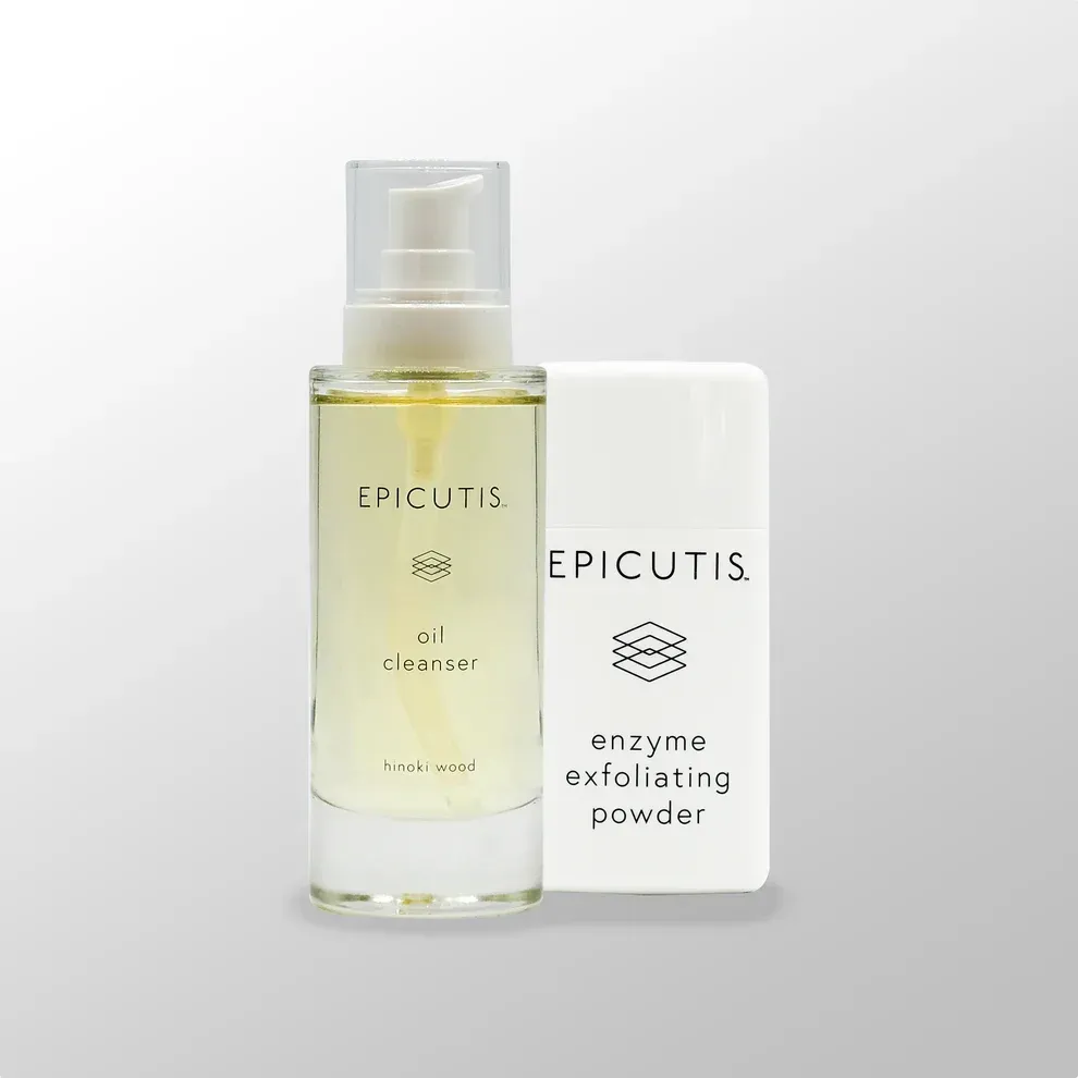 A bottle of epicutis oil cleanser and an enzyme exfoliating powder