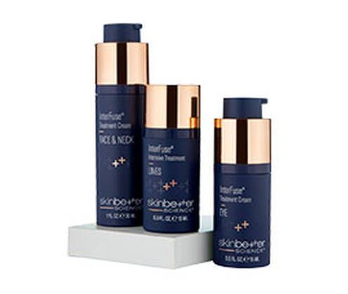 Three bottles of skincare products are sitting on top of each other on a white shelf.