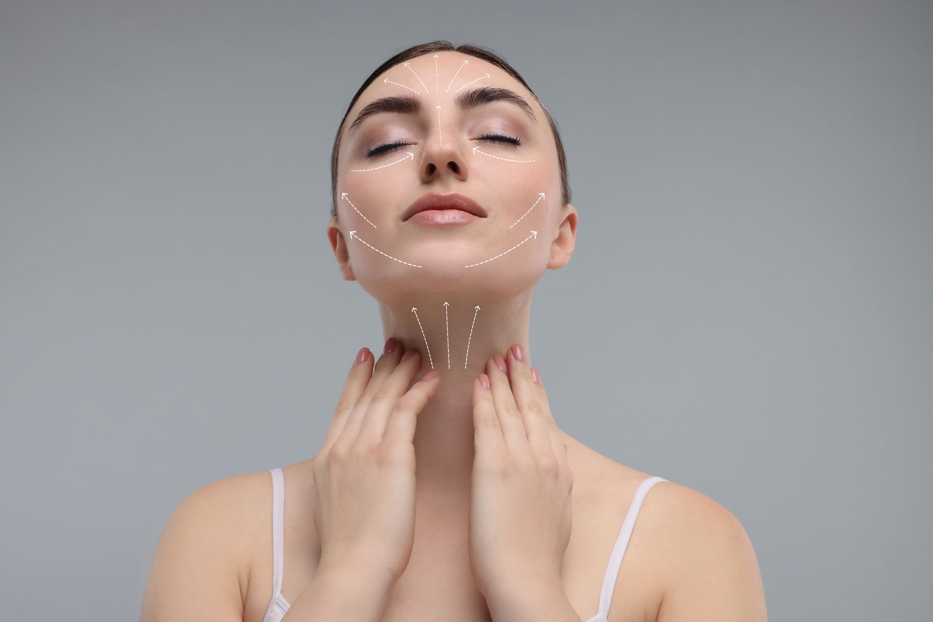 A woman is touching her neck with lines drawn on her face.