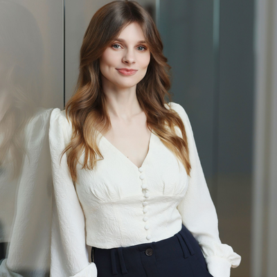 a personal injury attorney in a suit and tie is adjusting his cufflinks