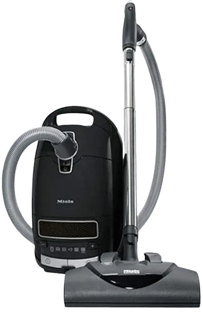 Black canister vacuum cleaner with hose and floor brush attachment on a white background
