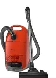 Red canister vacuum cleaner with hose, wand, and floor brush on a white background