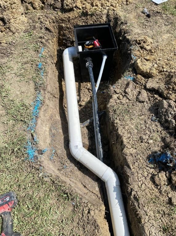 A Pipe Is Being Installed in A Hole in The Ground — Top To Bottom Plumbing in Garbutt, QLD