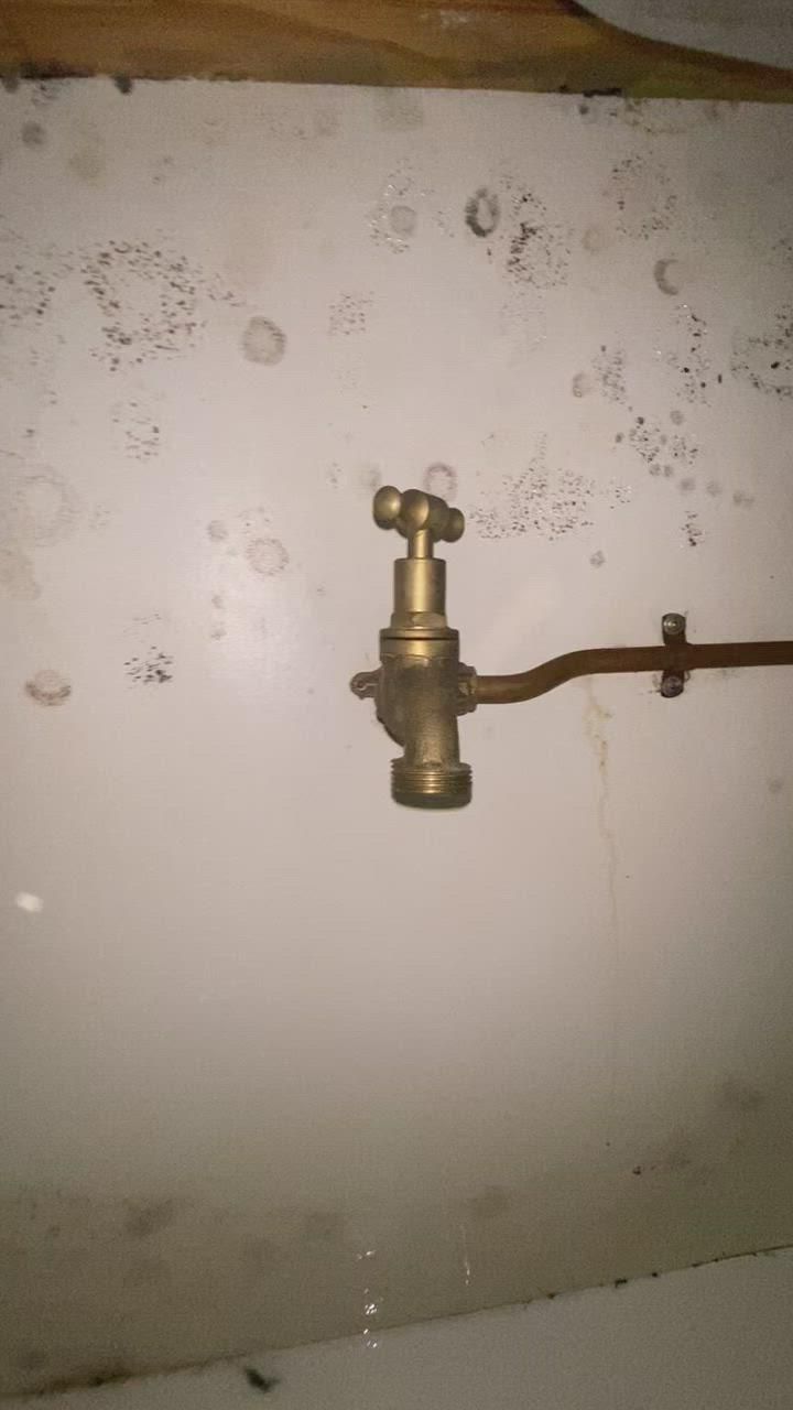 A Close up Of a Brass Faucet on A White Wall — Top To Bottom Plumbing in Garbutt, QLD
