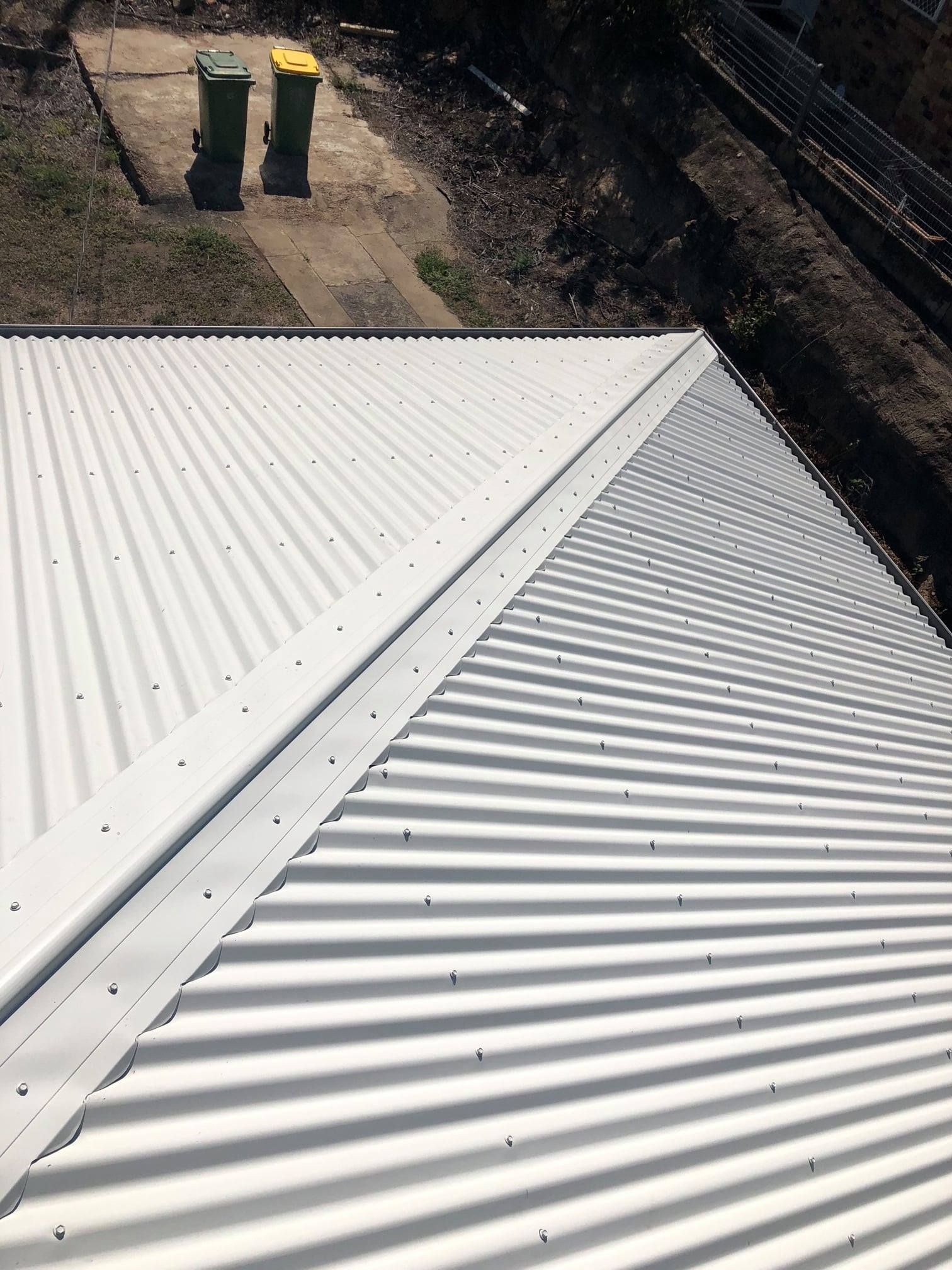 White Corrugated Metal Roof With Seam — Top To Bottom Plumbing in Garbutt, QLD