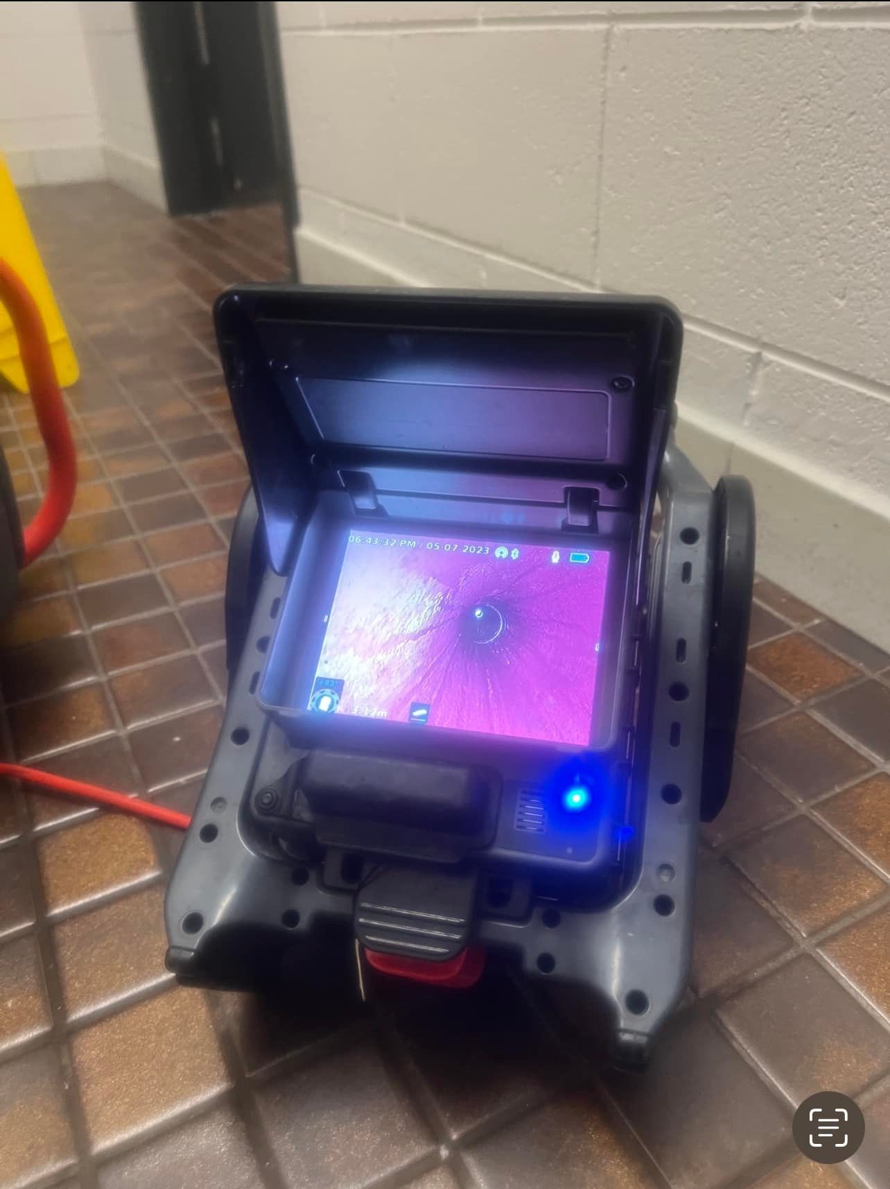 Grey CCTV Drain Camera With a Screen, on a Tiled Floor — Top To Bottom Plumbing in Garbutt, QLD