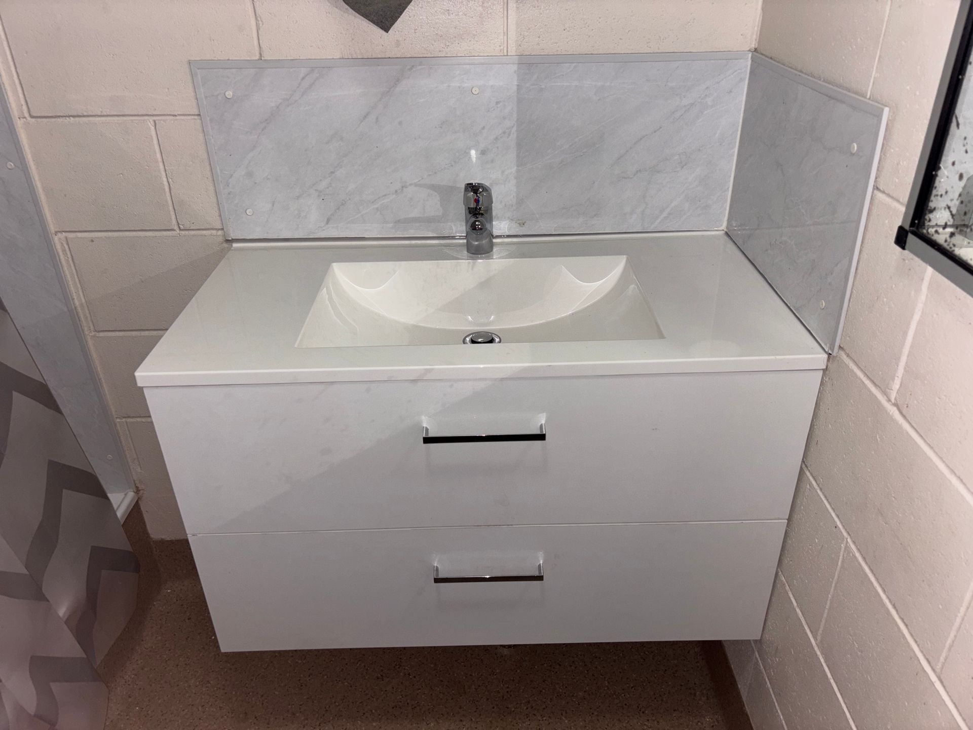 A Bathroom Is Being Remodeled with A Hole in The Wall and A Shower Stall — Top To Bottom Plumbing in Garbutt, QLD