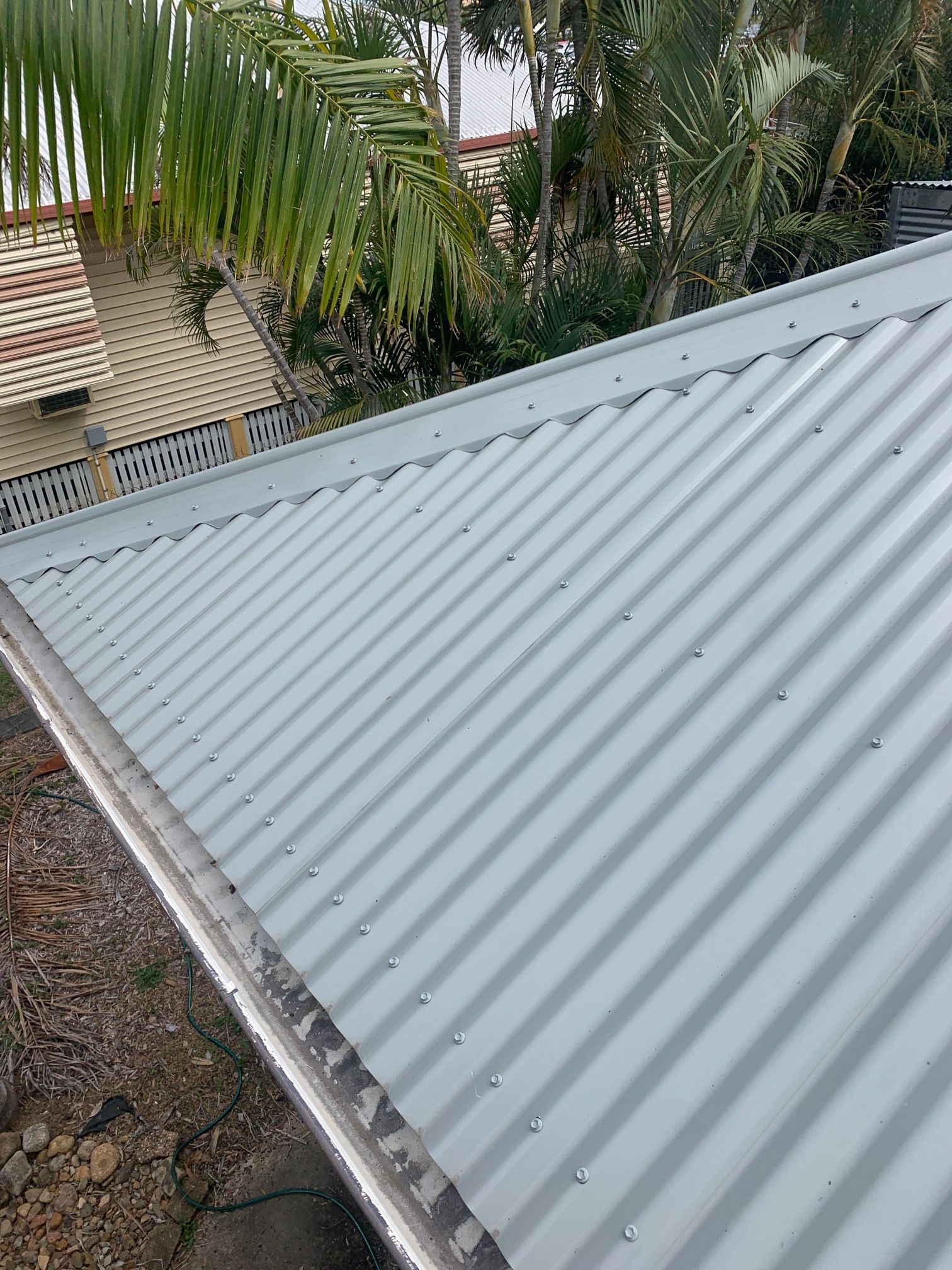 A Close up Of a Gutter with A Mesh on It — Top To Bottom Plumbing in Garbutt, QLD