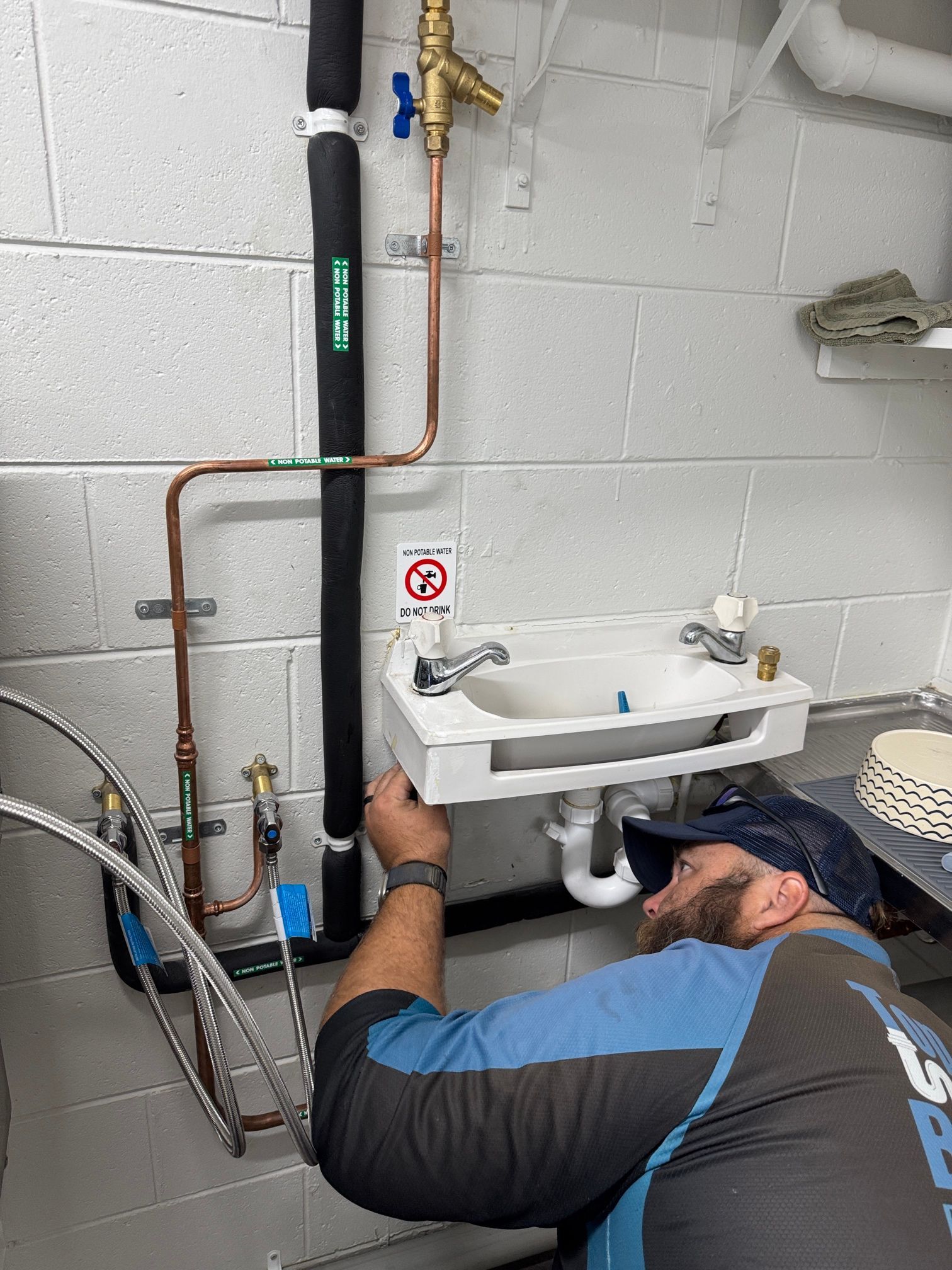 A Kitchen Sink with Two Sinks and A Faucet — Top To Bottom Plumbing in Garbutt, QLD