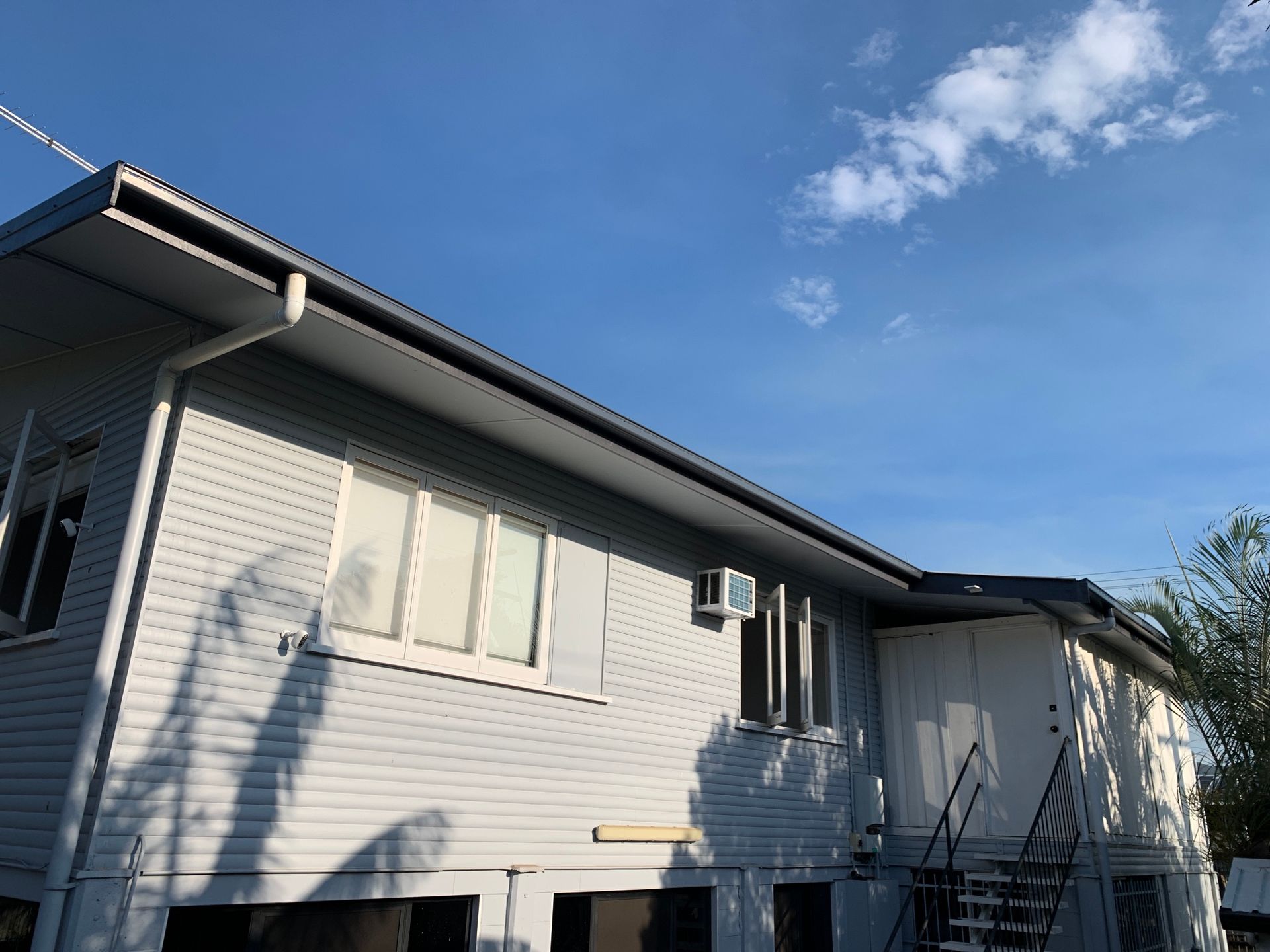 Light gray house with gutters - Top To Bottom Plumbing in Garbutt, QLD