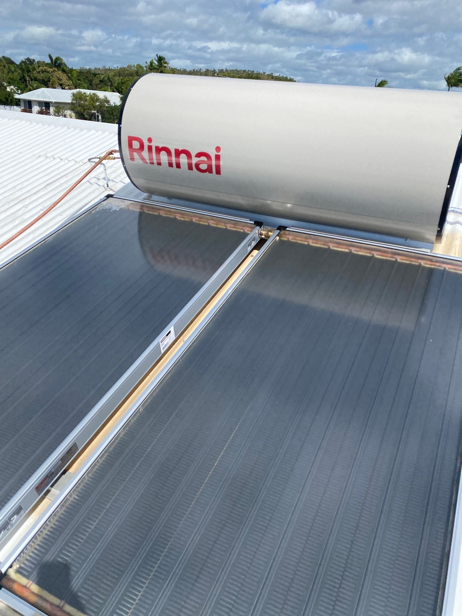 A Solar Panel Is on The Roof of A House — Top To Bottom Plumbing in Garbutt, QLD