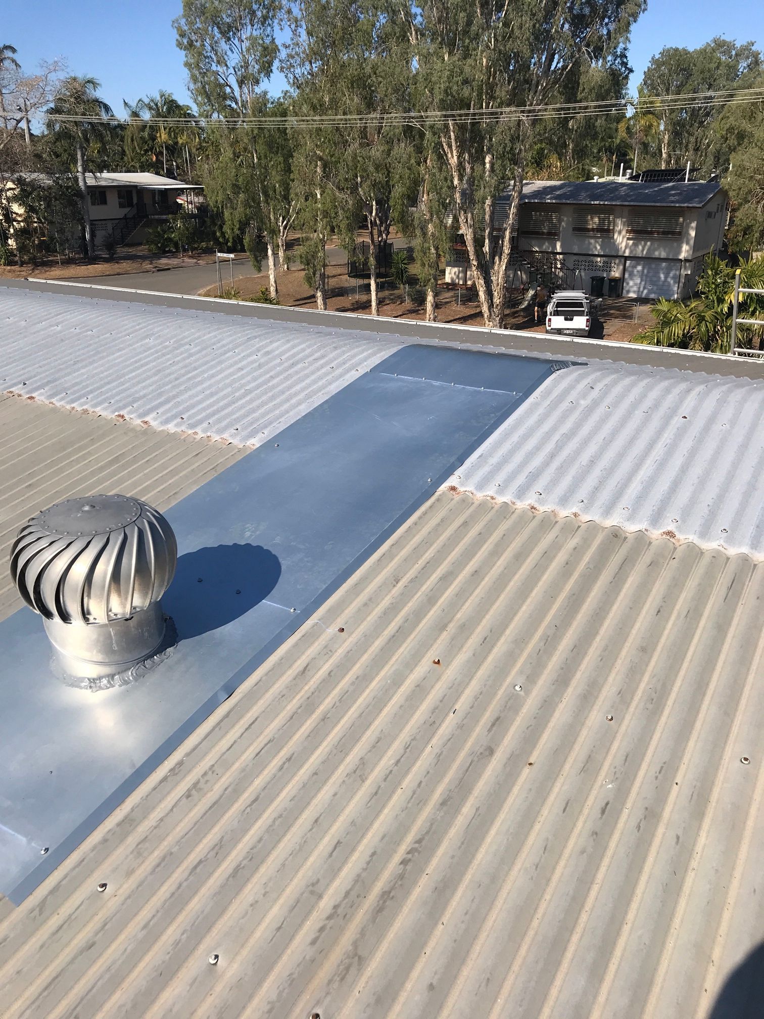 A Close up Of a Gutter on The Side of A Building — Top To Bottom Plumbing in Garbutt, QLD