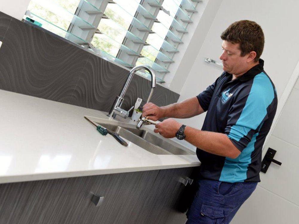 Emergency Plumber Fixing Tap