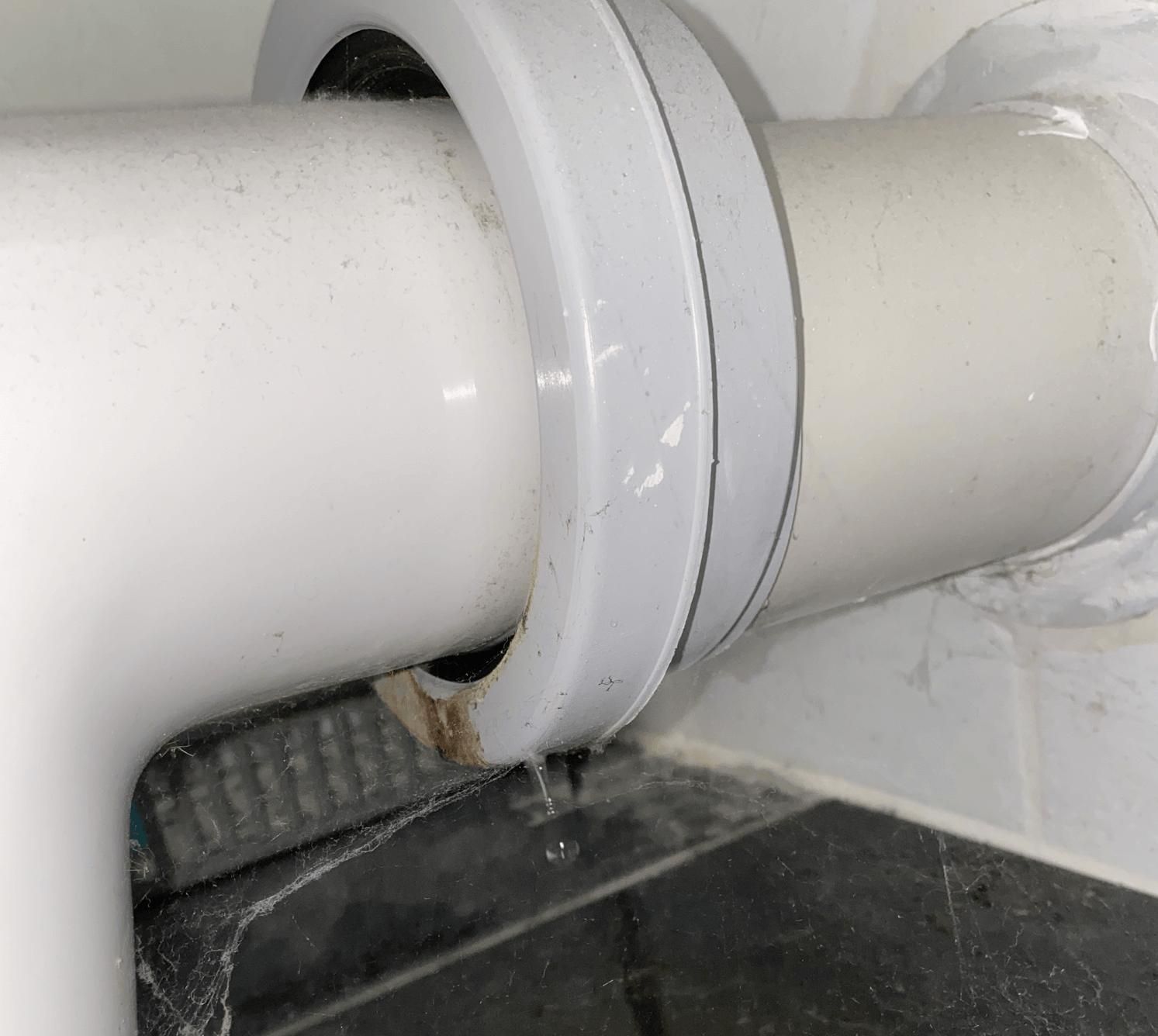 A Close up Of a White Pipe with A Hole in It — Top To Bottom Plumbing in Garbutt, QLD