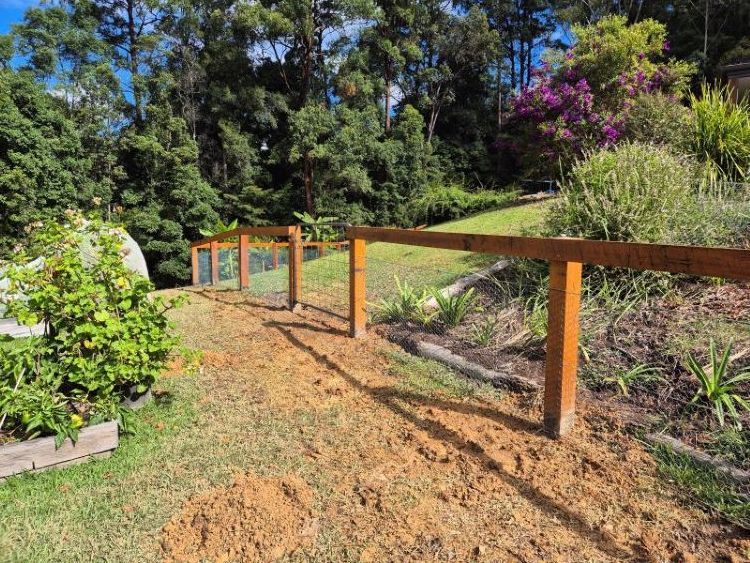 A Wooden Fence with Wire Mesh — Barry Brown Rural Contracting Service in Gloucester, NSW