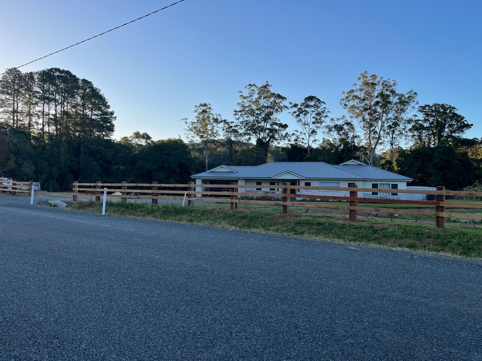 A Man Observing Fence Construction — Barry Brown Rural Contracting Service in Tinonee, NSW