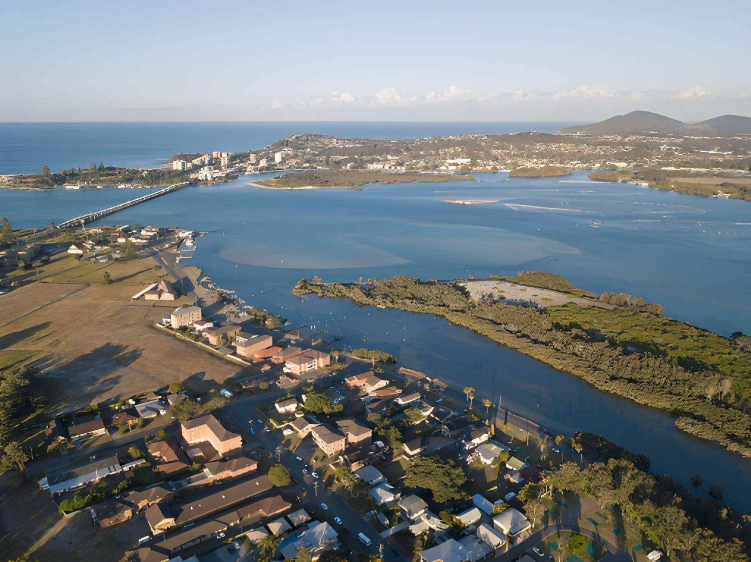 Aerial View of A Coastal Town with A Bridge — Barry Brown Rural Contracting Service in Forster, NSW