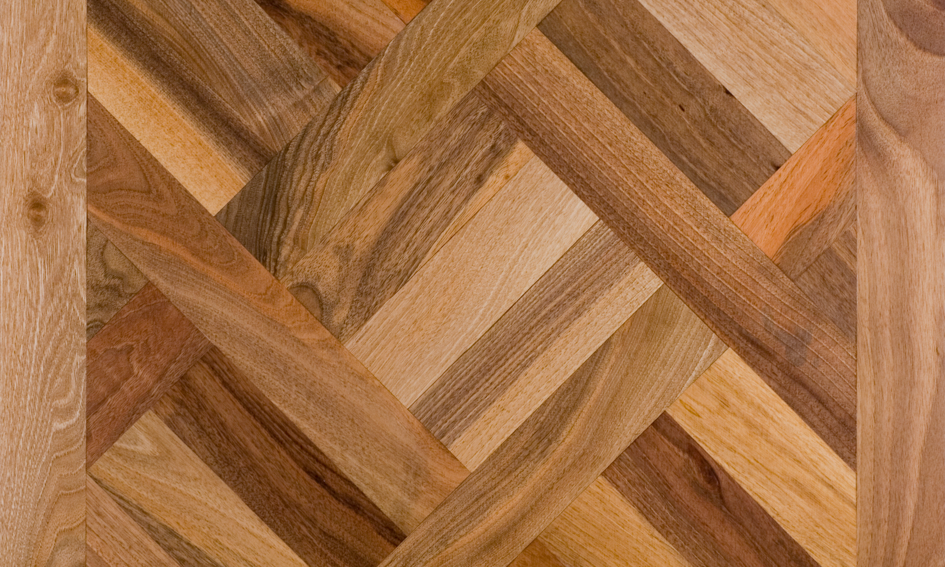 A photo of a unique and complex flooring design. The complex design looks good and would need a skilled craftsman to obtain this type of flooring.