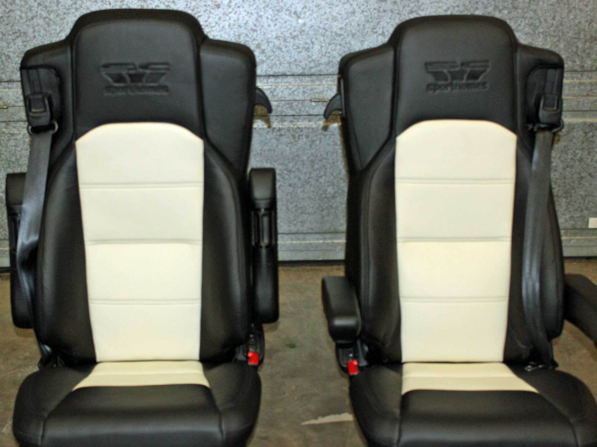 Two car seats with black and white upholstery.