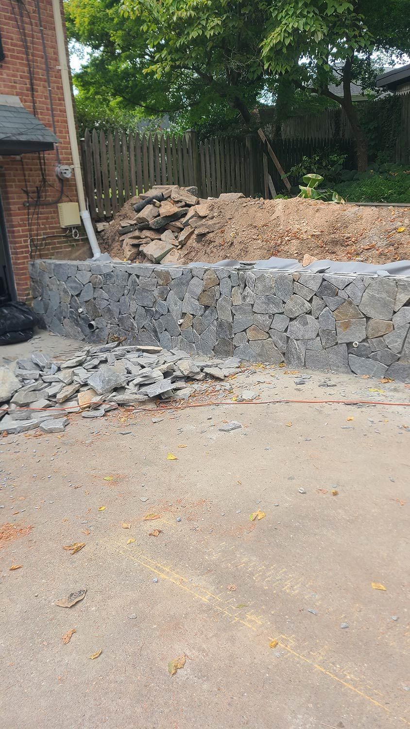 Construction of a Stone Wall in Backyard