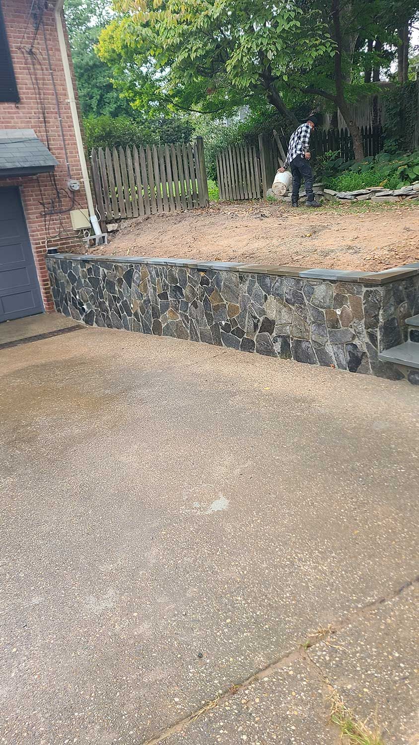 High-Quality Stone Wall in Backyard