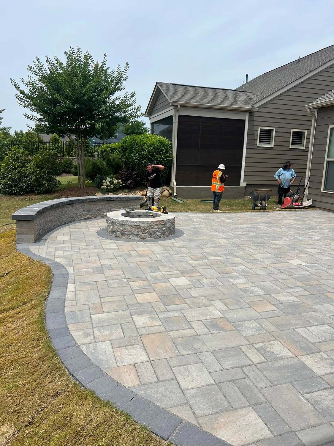 There is a fire pit in the middle of the patio