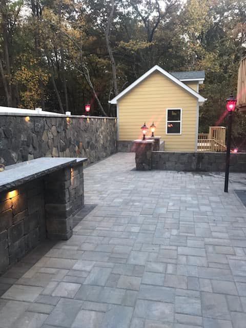 A Patio with a Stone Wall
