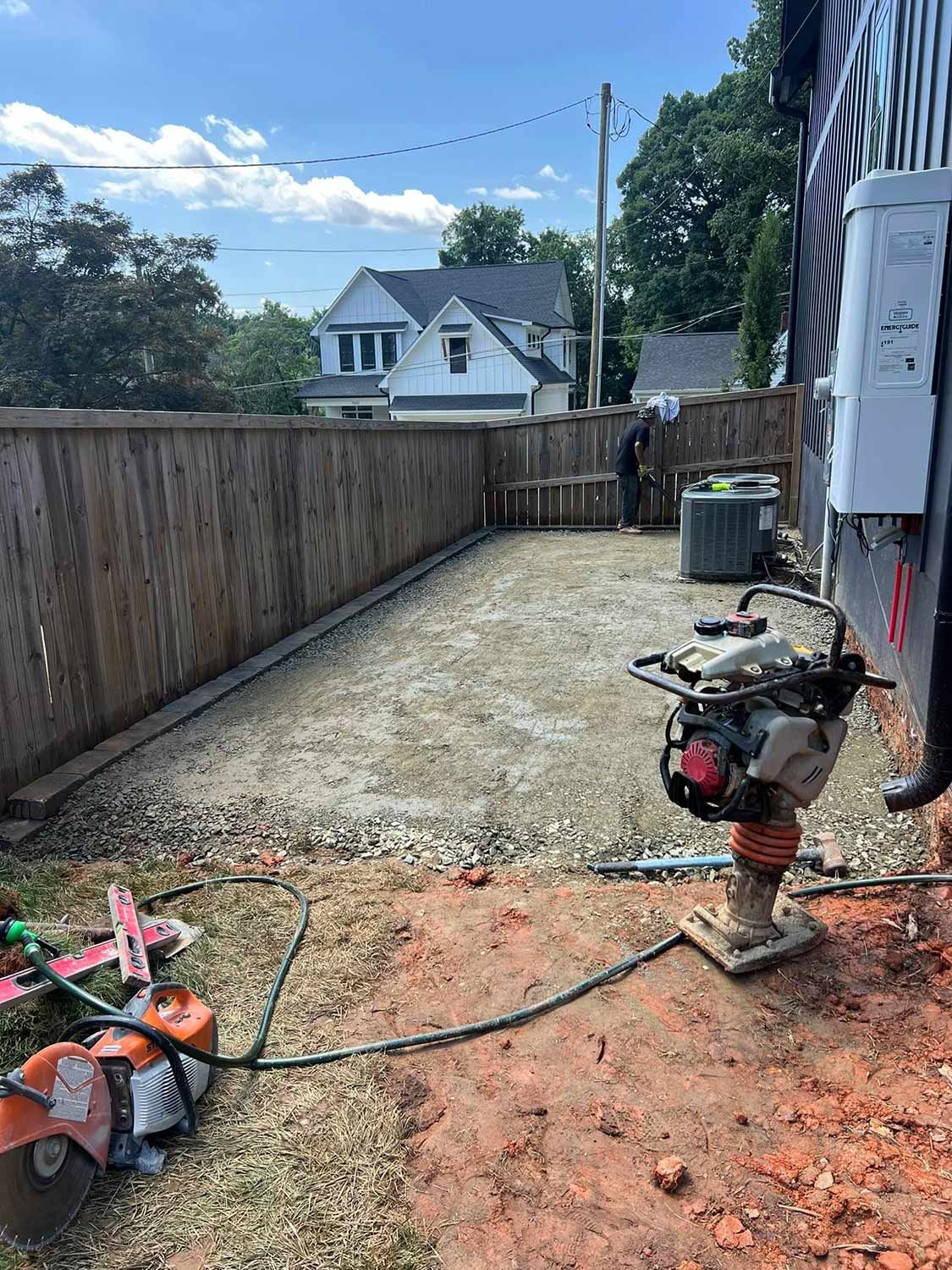 Worker Cleaning the Old Backyard