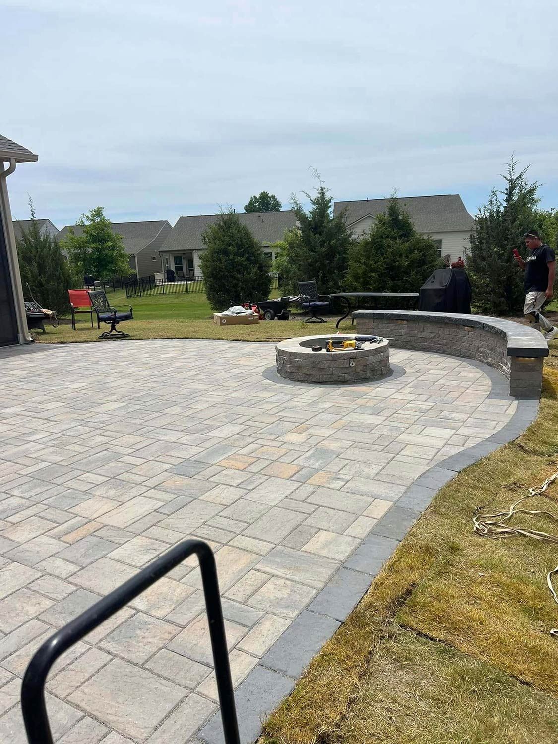 There is a fire pit in the middle of the patio.