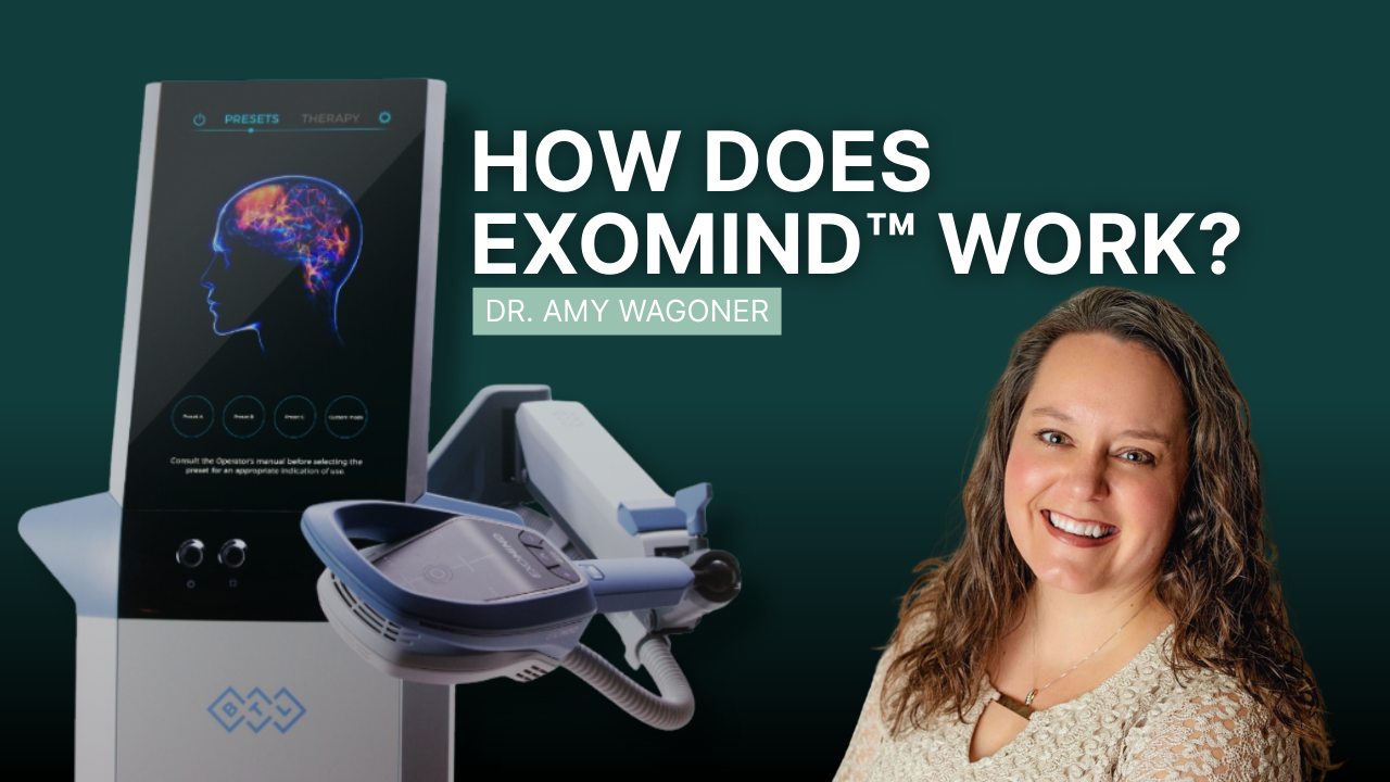 A woman is sitting on a couch next to a machine.