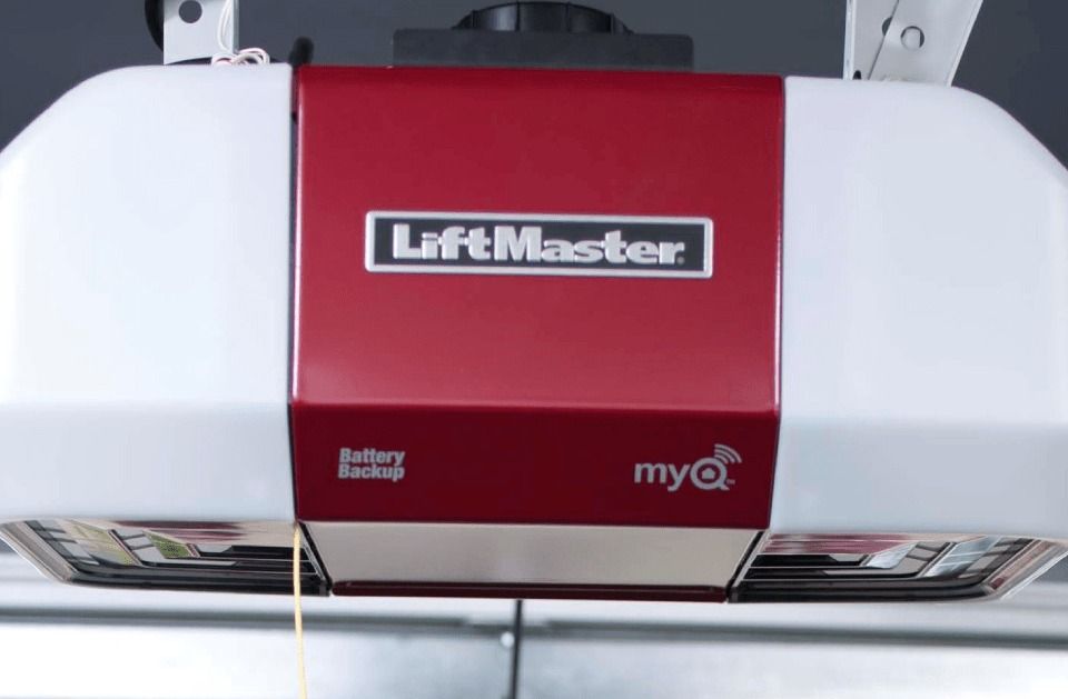 A red and white liftmaster garage door opener