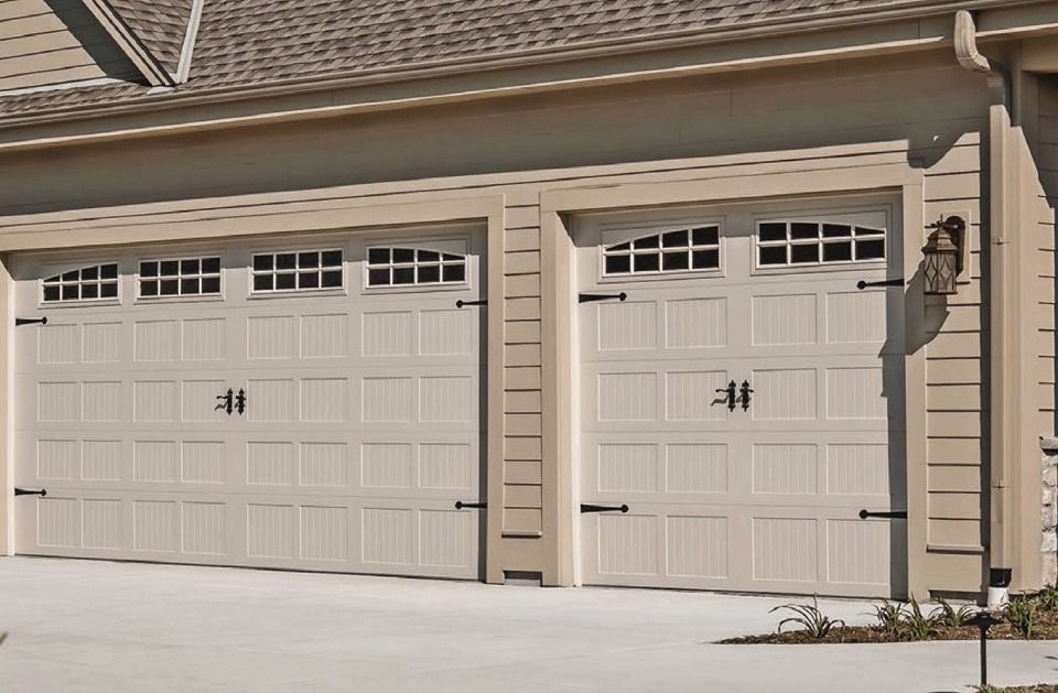 A house with three garage doors with the number 44 on them