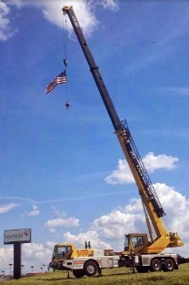 Yellow Crane Lifting Flag - Crane Rental