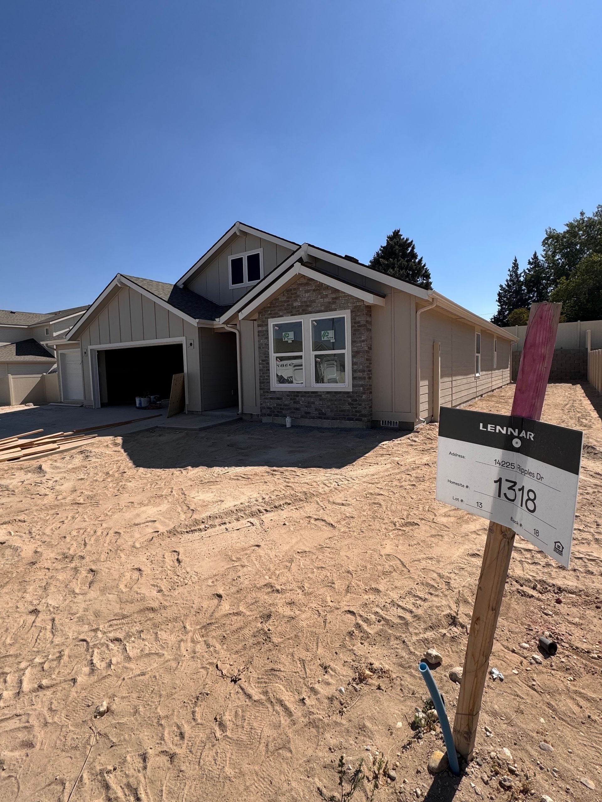 New house under construction with a sign labeled 