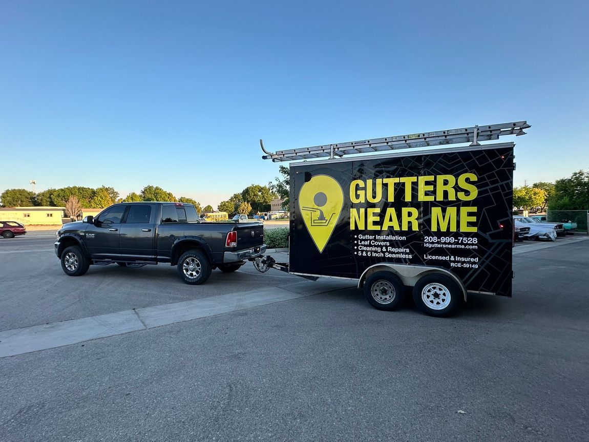 A truck is towing a trailer that says 