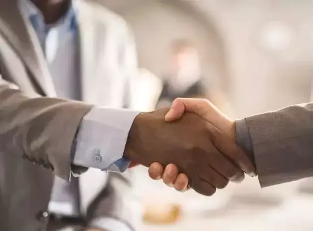 two people shaking hand