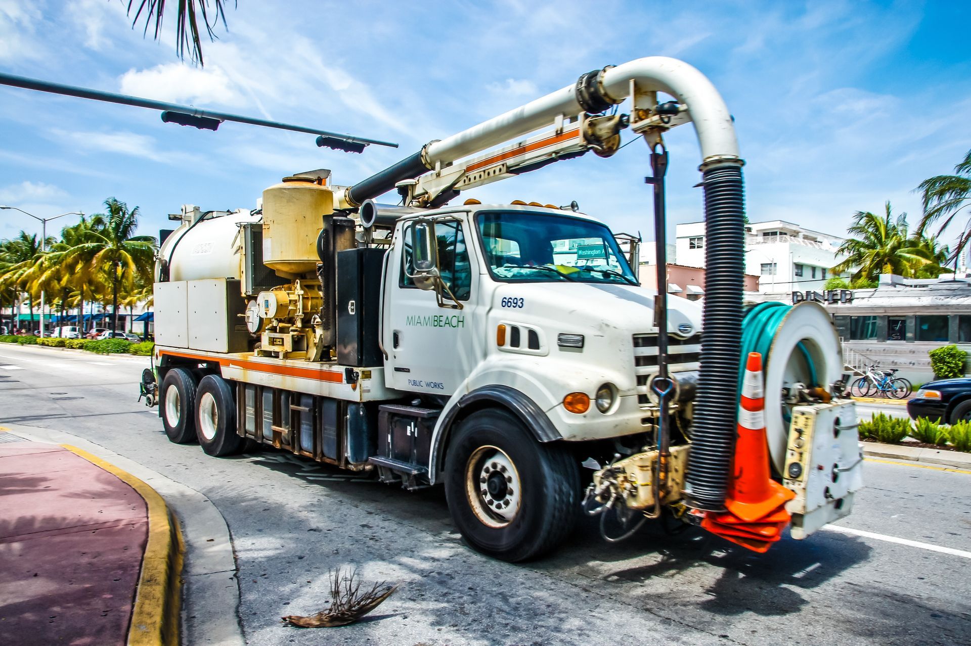 A white vacuum truck