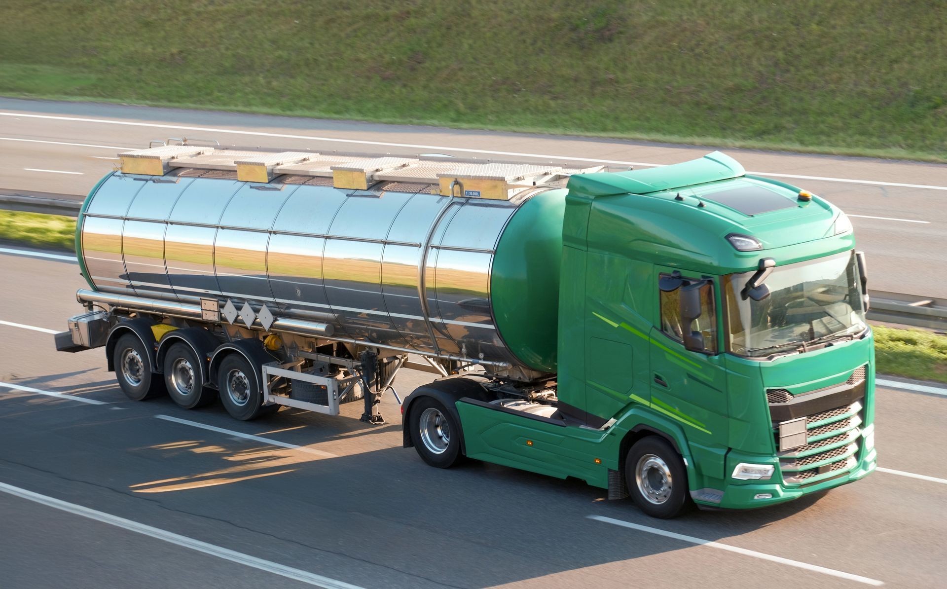 A green tanker truck
