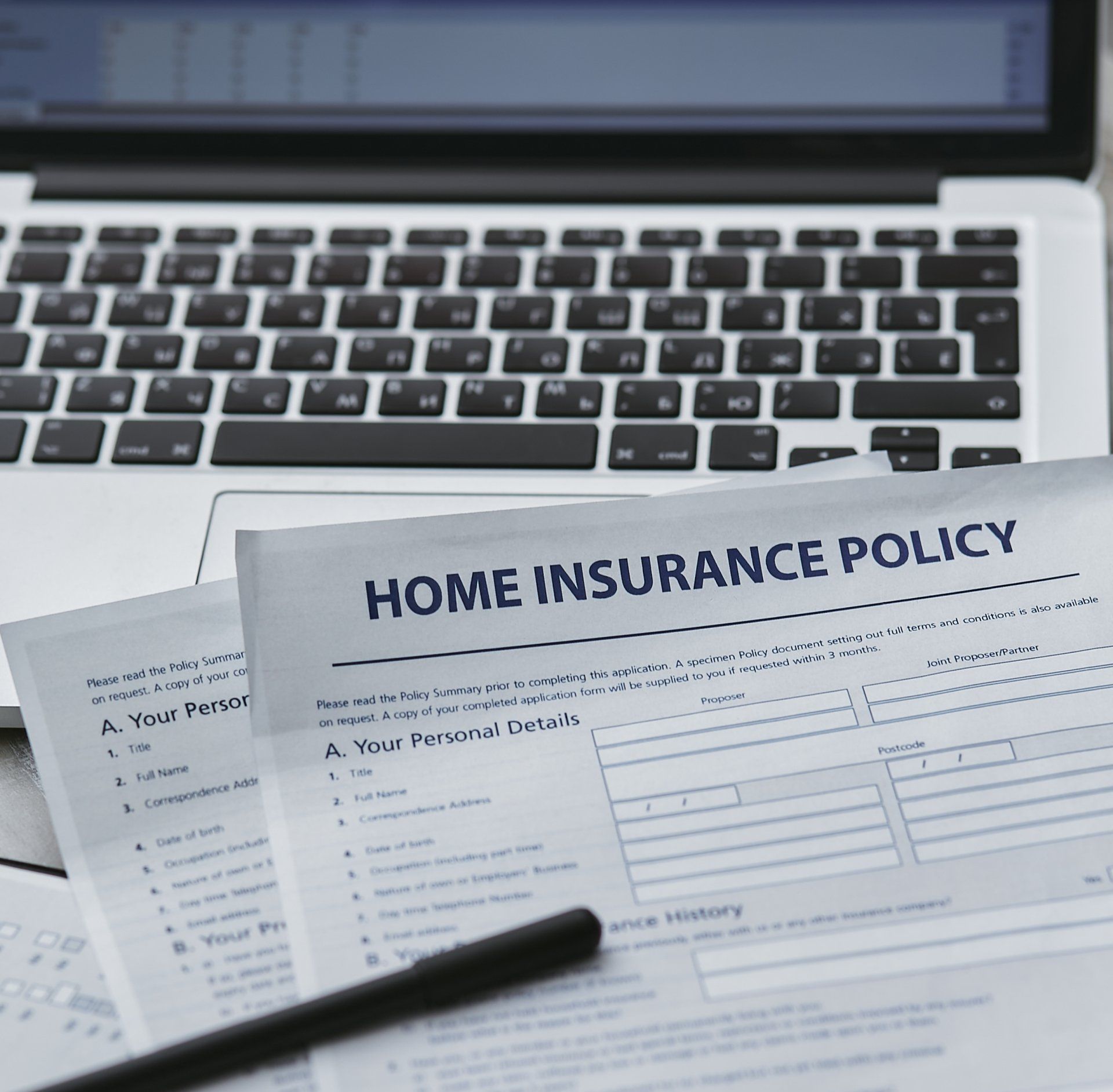 A piece of paper that says home insurance policy on it