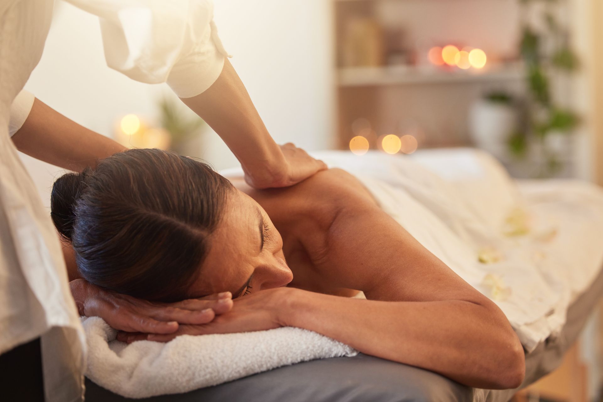 A woman is getting a massage at a spa.