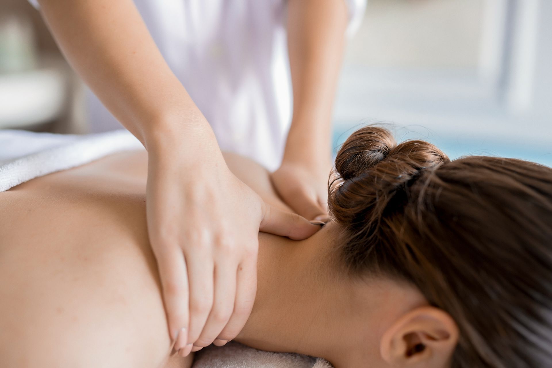 a woman is getting a massage on her back