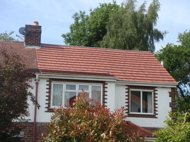 Roof maintenance - Warrington - RWJ Roofing Ltd - house with chimney thumbnail