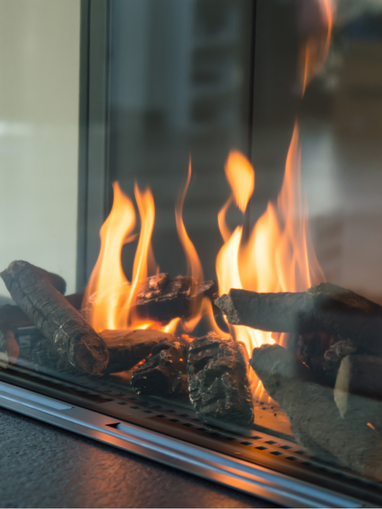 Full Time Heating & Cooling | A fireplace with a lot of flames coming out of it