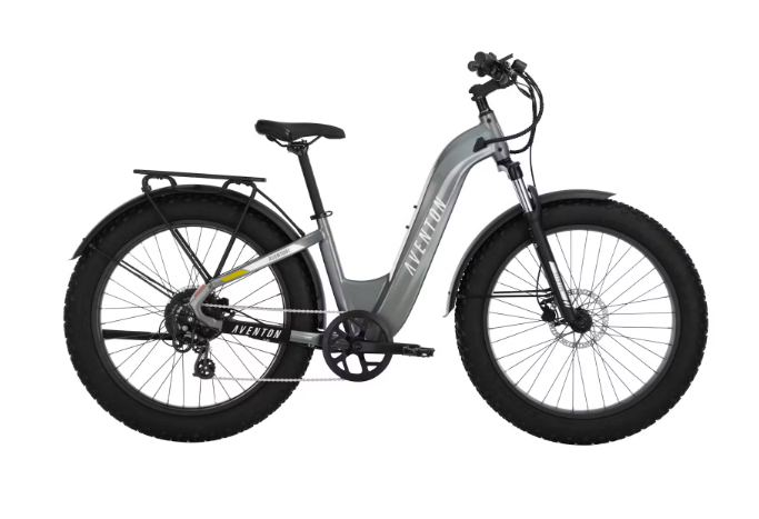 A gray electric bike with a large tire on a white background.