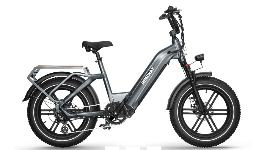 A gray electric bike with a large tire on a white background.